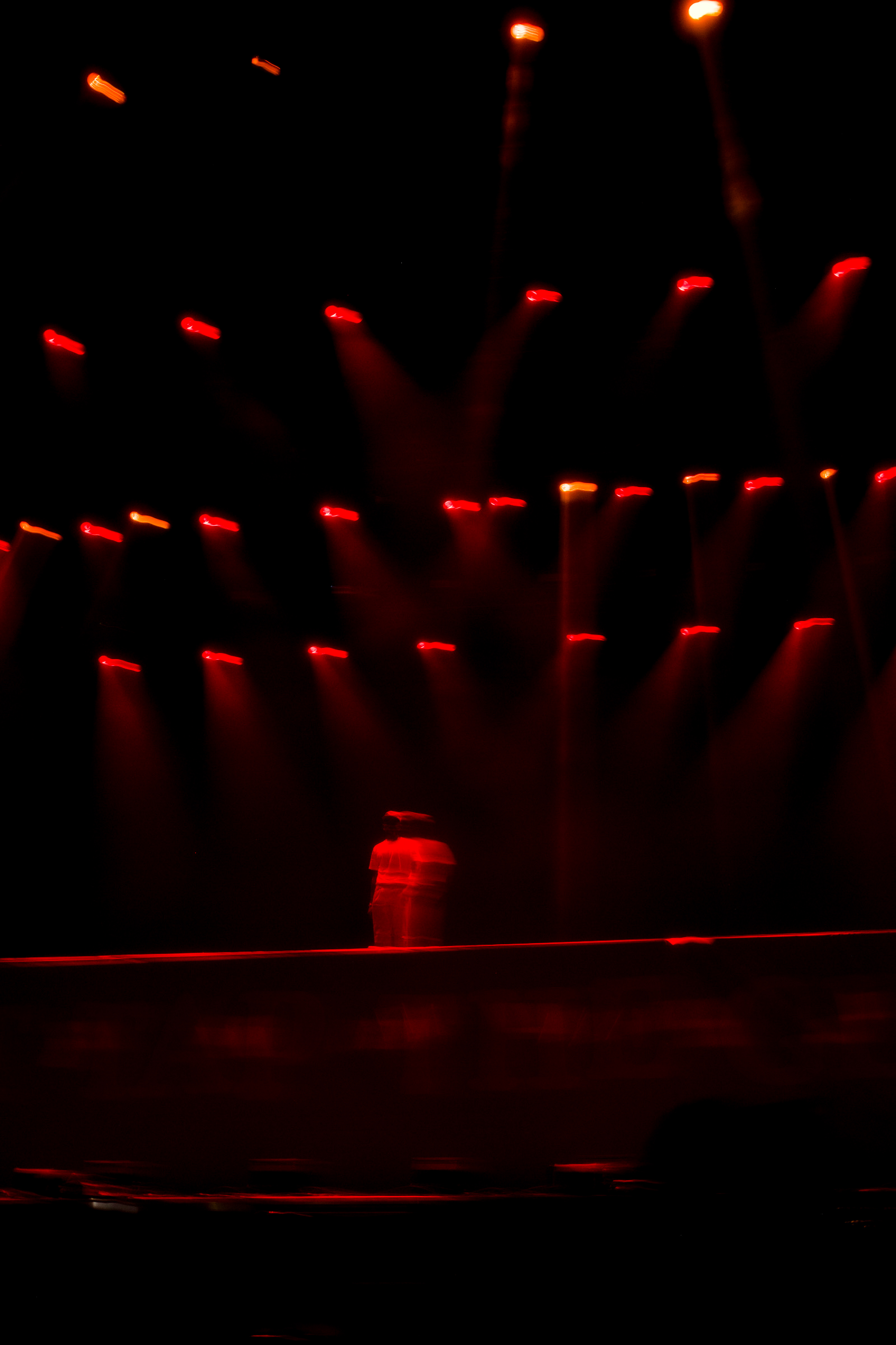 Tyler, The Creator silhouette under red stage lights at Lollapalooza