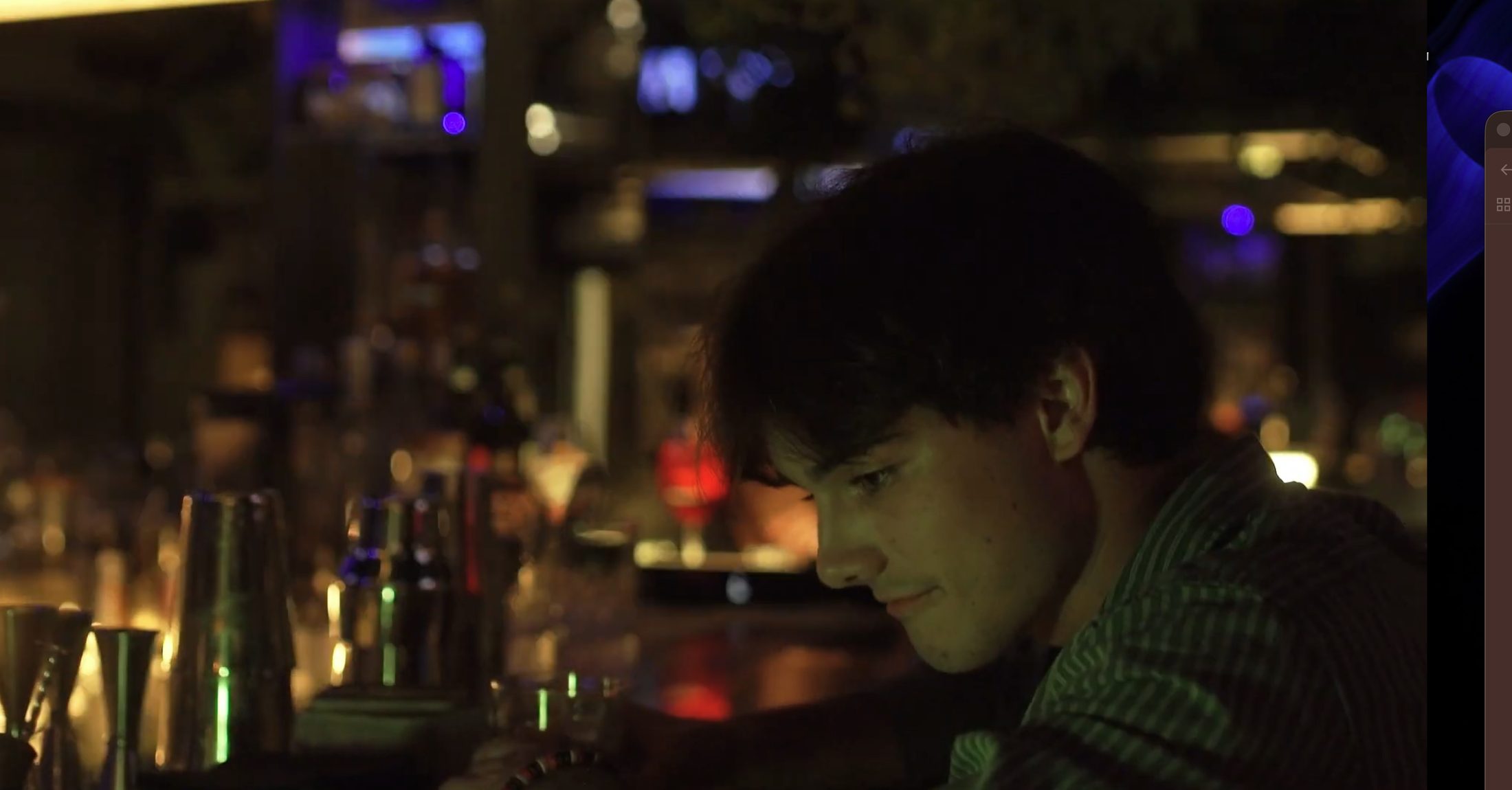 Still from the When I'm Small music video, a couple at a bar in Florence, Italy
