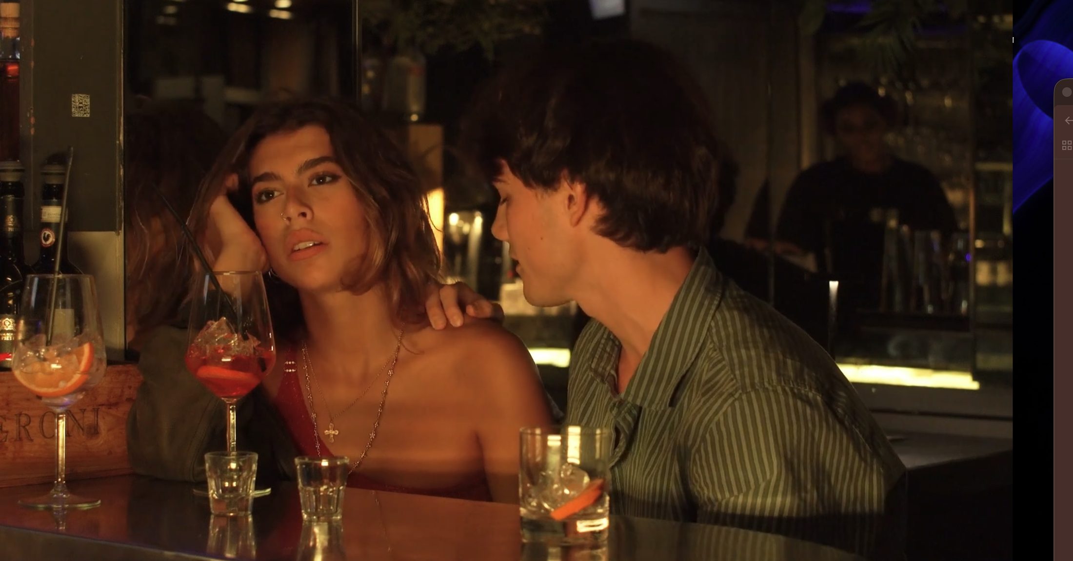 Still from the When I'm Small music video, a couple at a bar in Florence, Italy