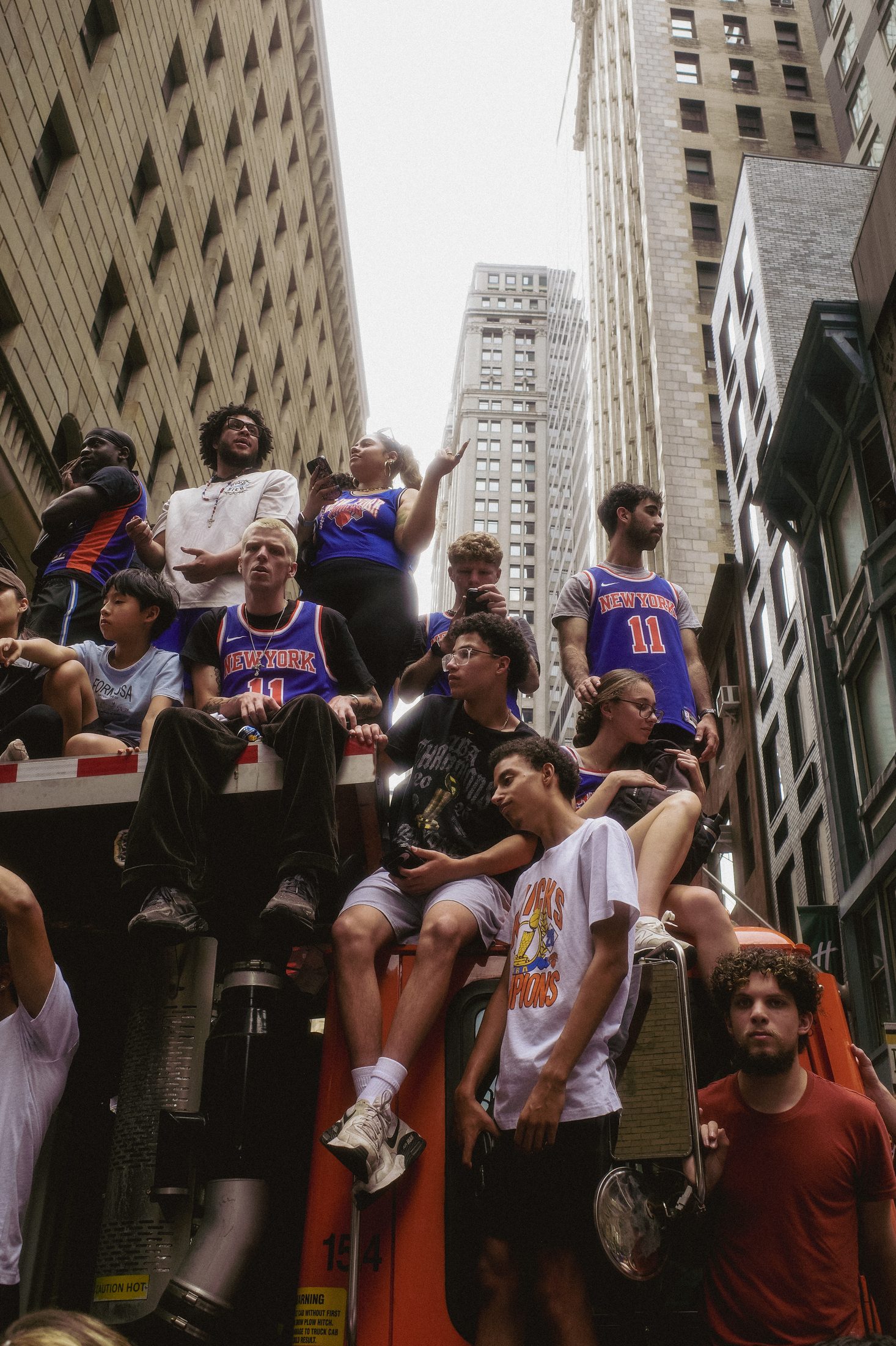 Knicks championship parade, crowd on a truck looking up at buildings