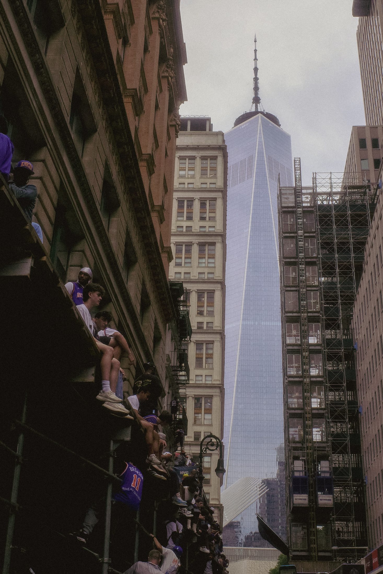 One World Trade Center seen from between buildings during the Knicks parade